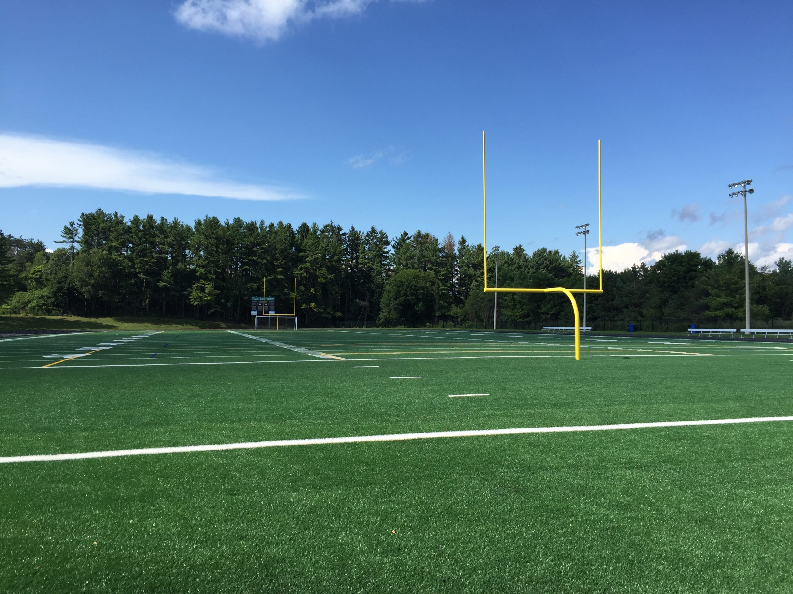 Football field with yellow goal post.