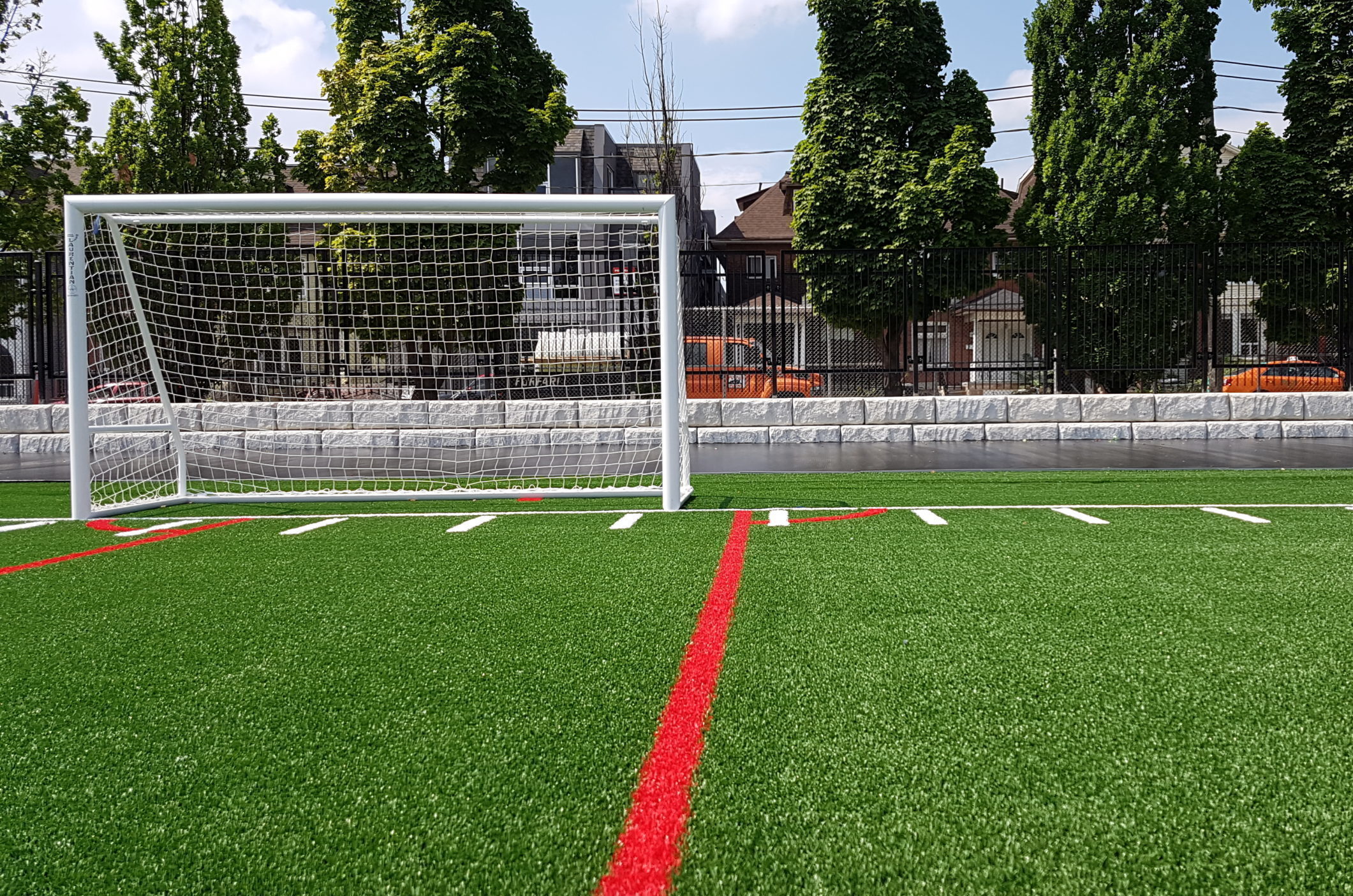 White soccer net on a field.