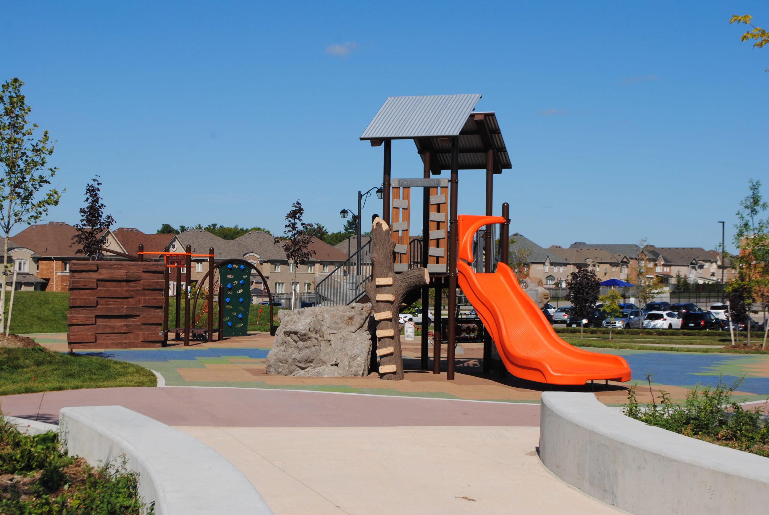 Children's playground with bright orange slide