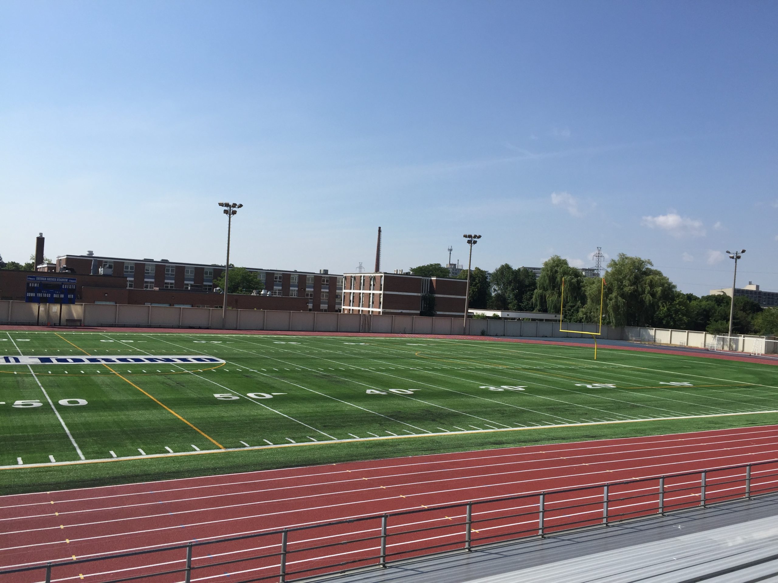 Football field with running track in the foreground.