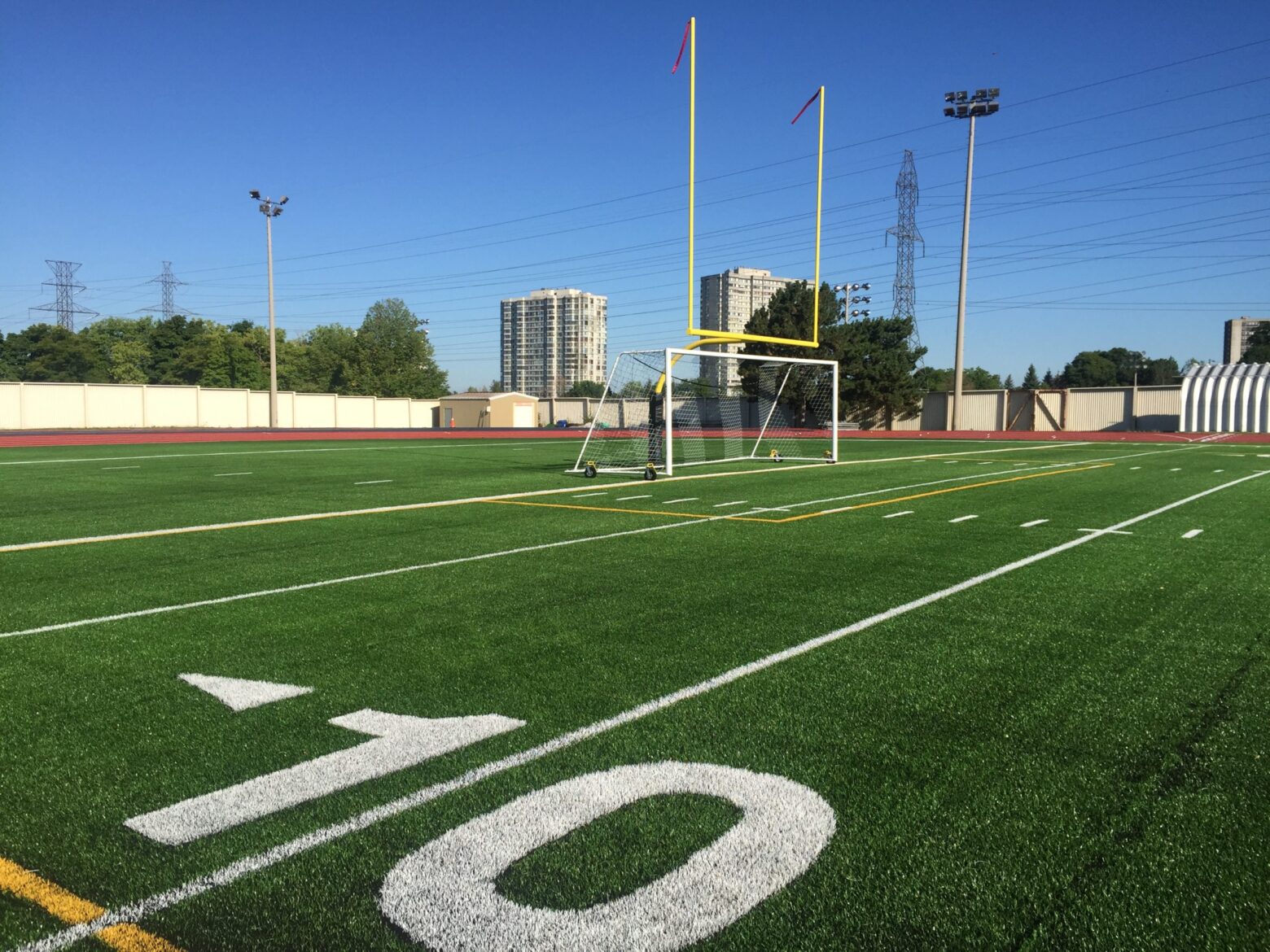 Football field with goal post in the background.