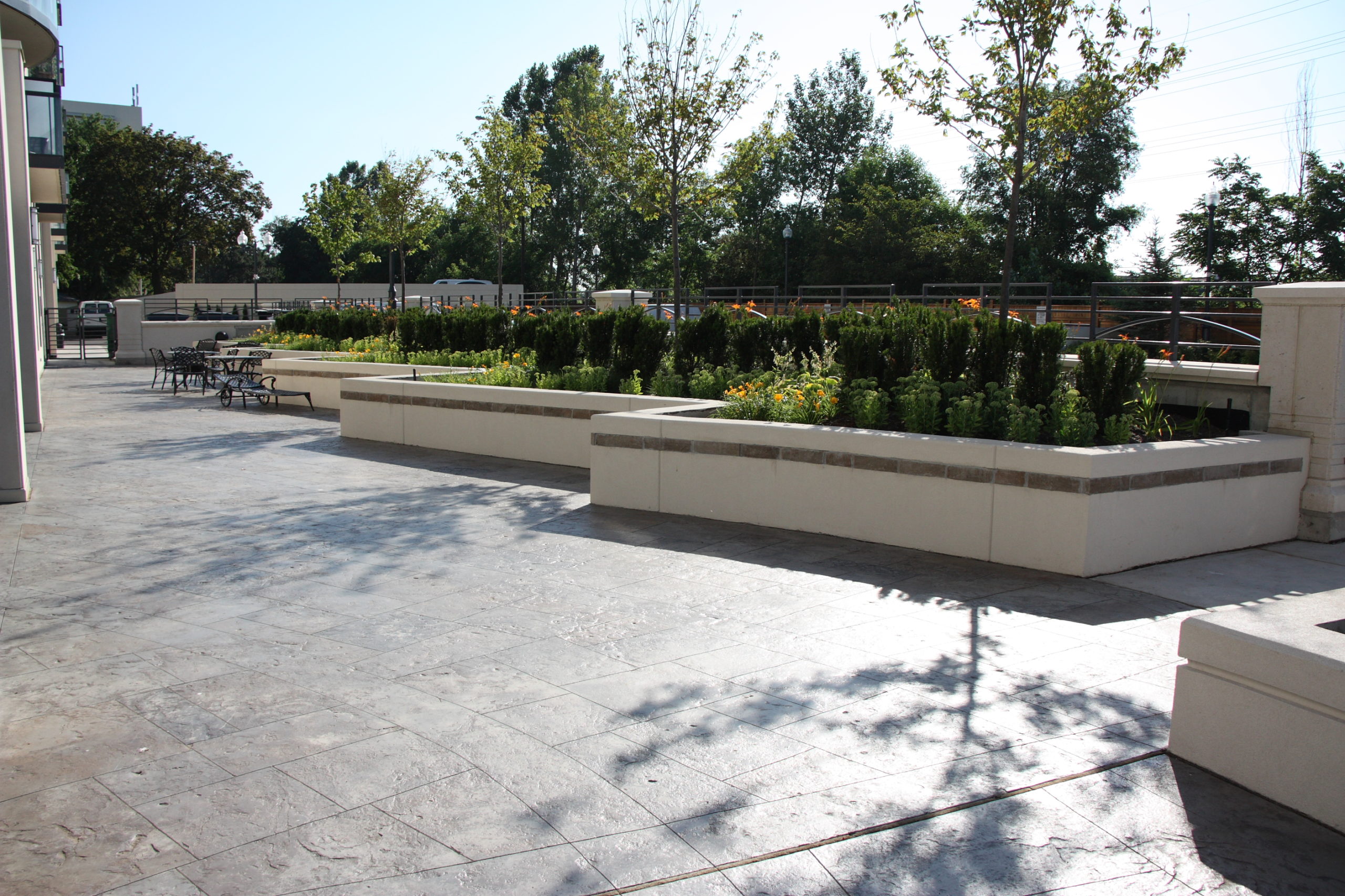 Several raised garden beds with various flowers inside.