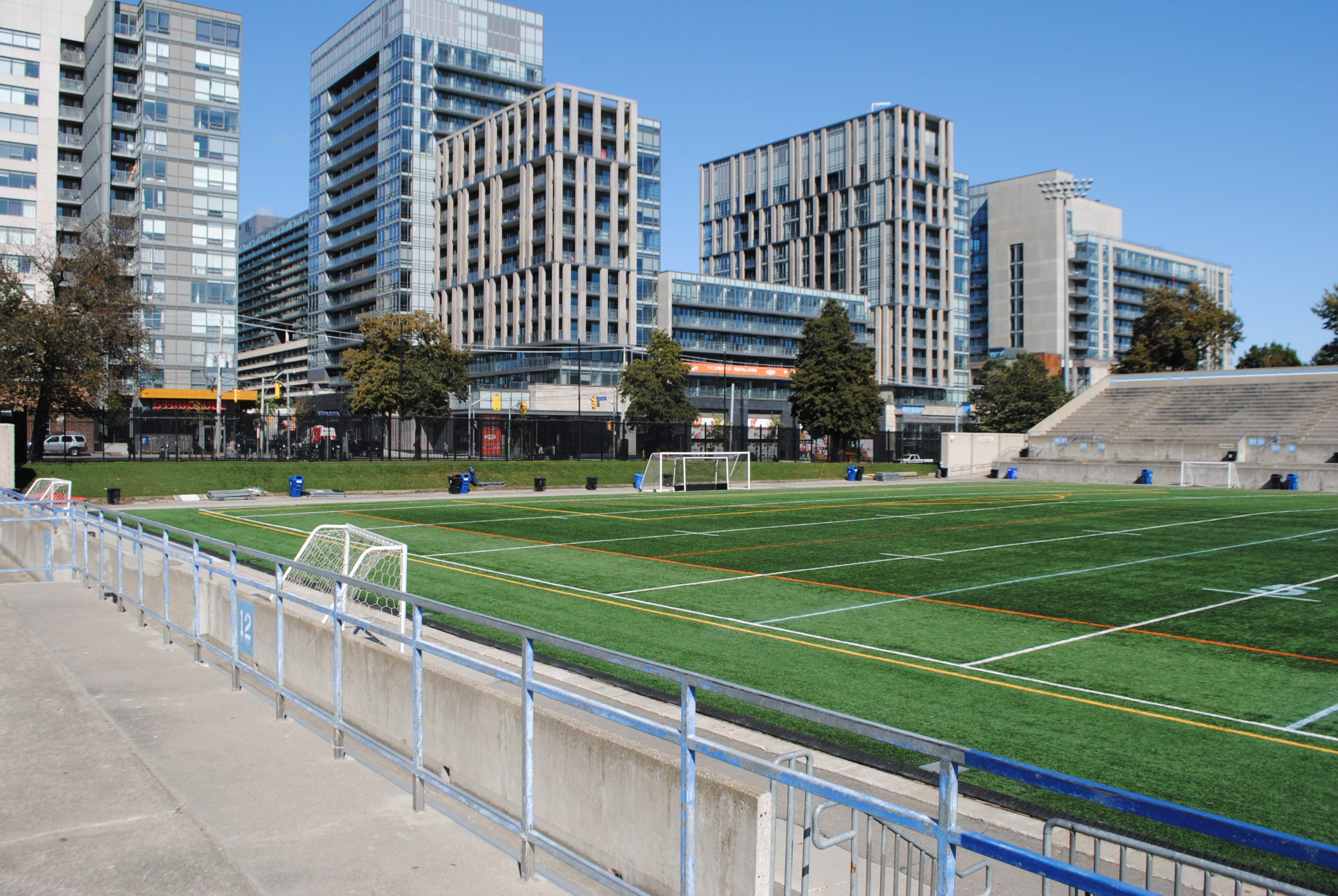 Soccer field with buildings in the background.