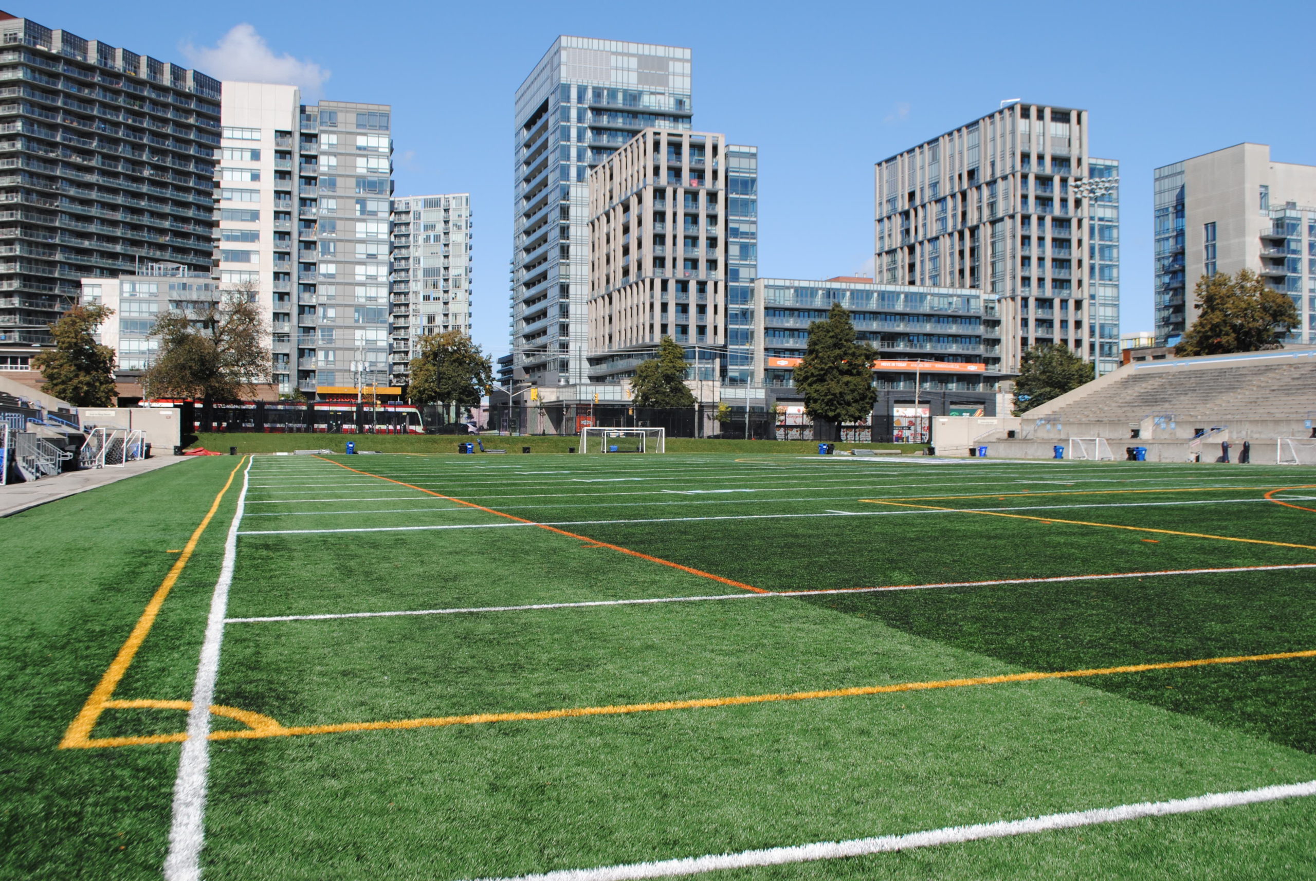 Soccer field with buildings in the background.