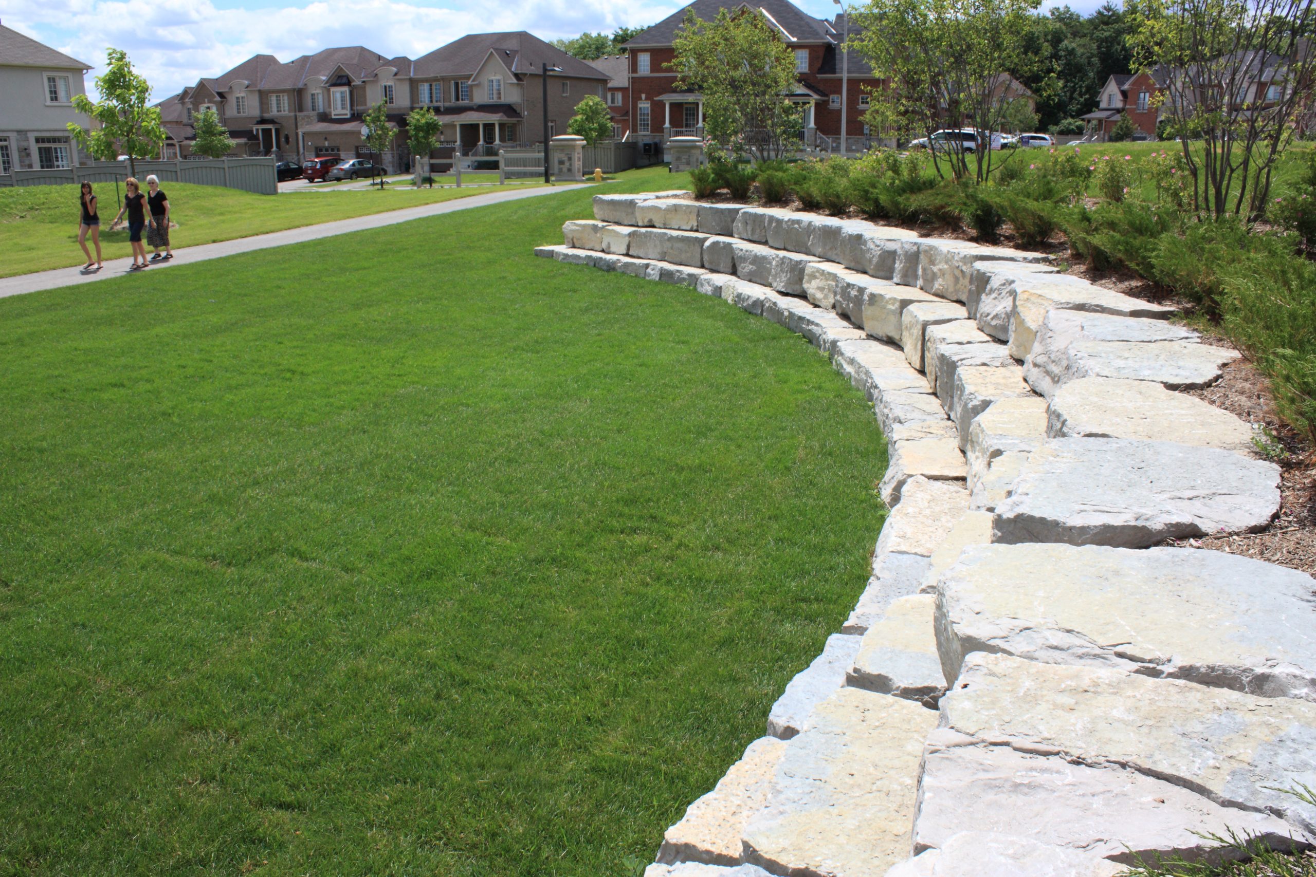 Large curved stone retainer wall.
