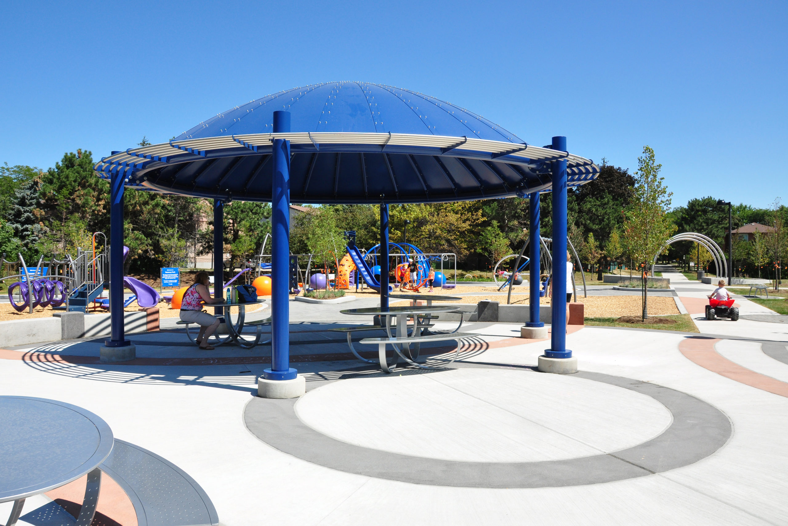 Shade structure with childrens playground.
