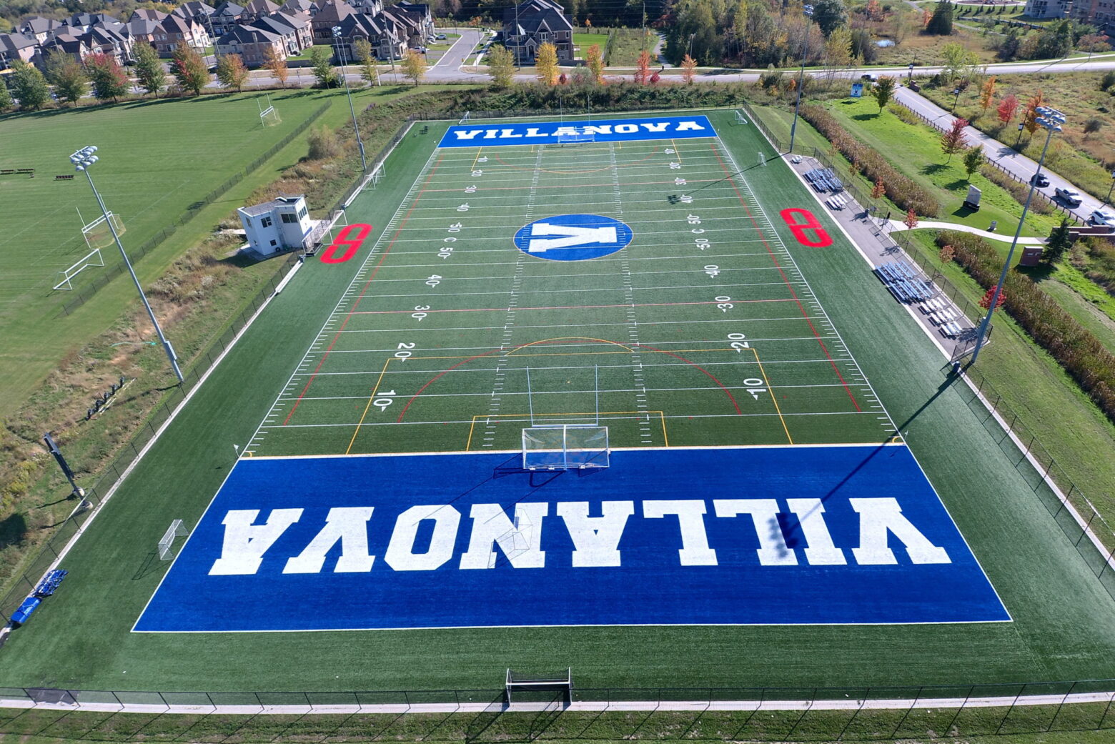 Birds eye view of soccer field with giant VILLANOVA branding on either end built into the field.