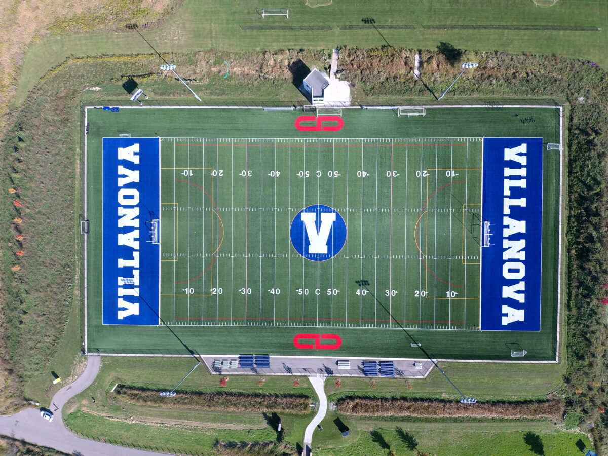 Birds eye view of soccer field with giant VILLANOVA branding on either end built into the field.