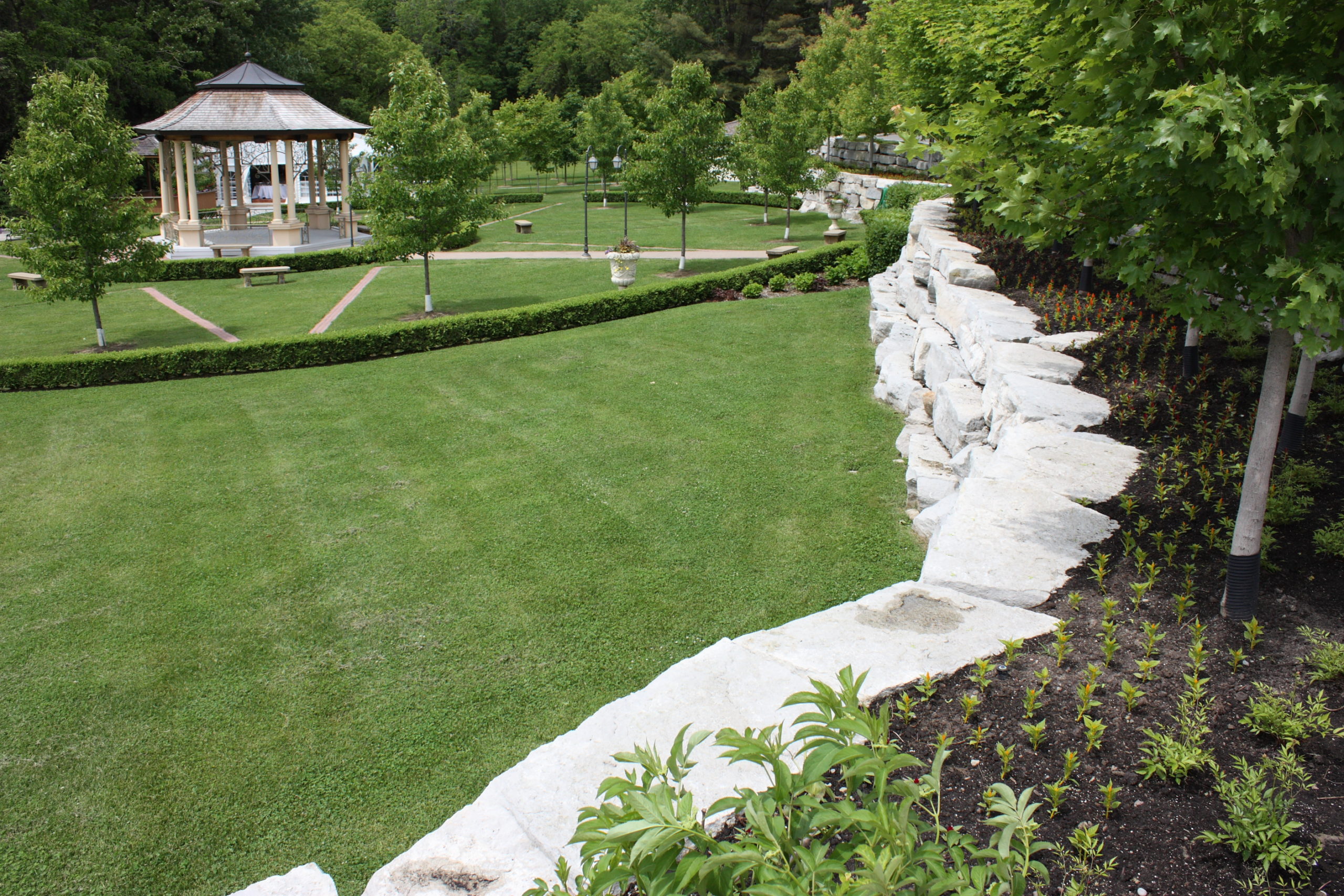 Stone retainer walls filled with gardens and trees